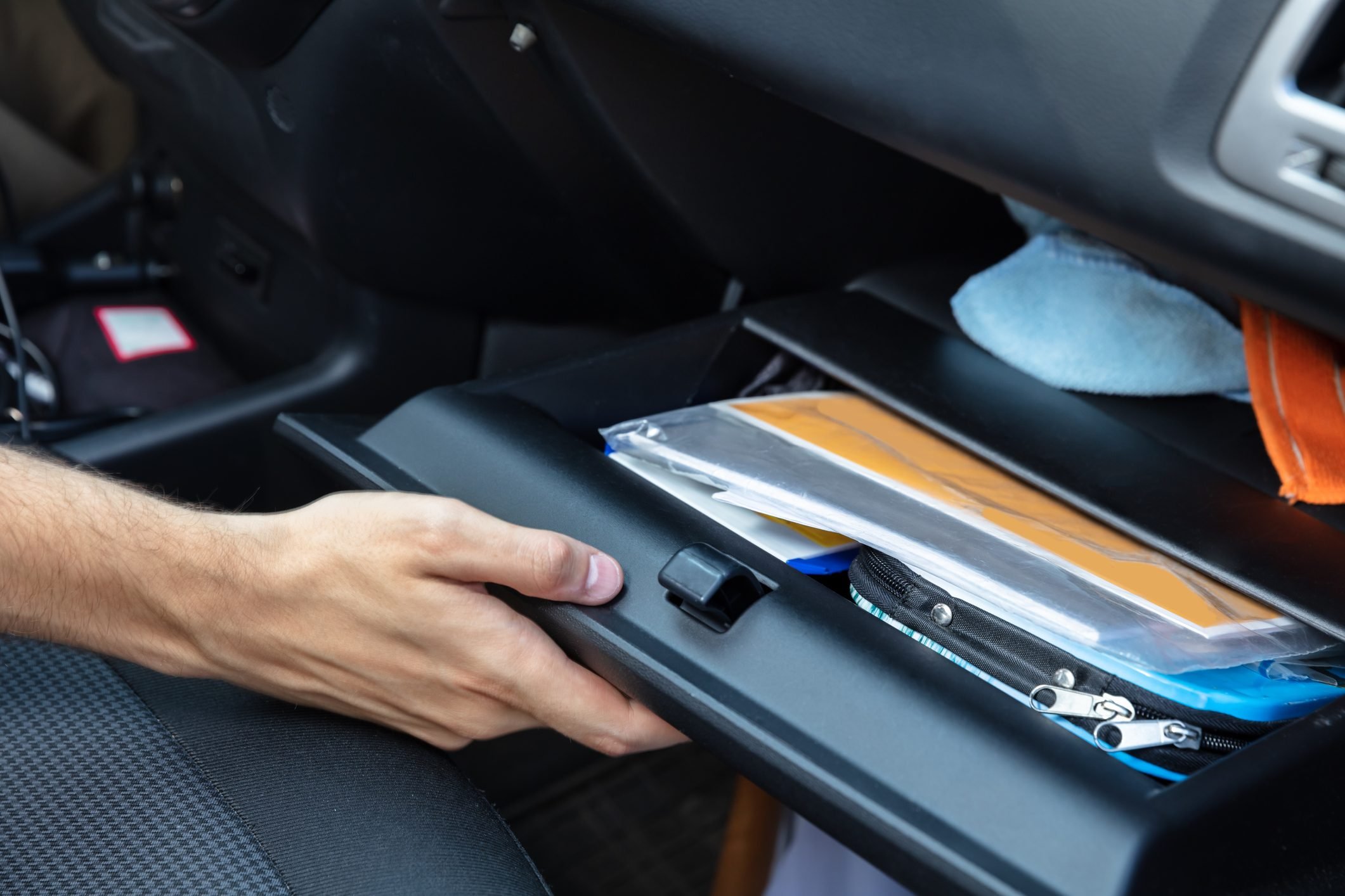 Driver Opening Glovebox Compartment