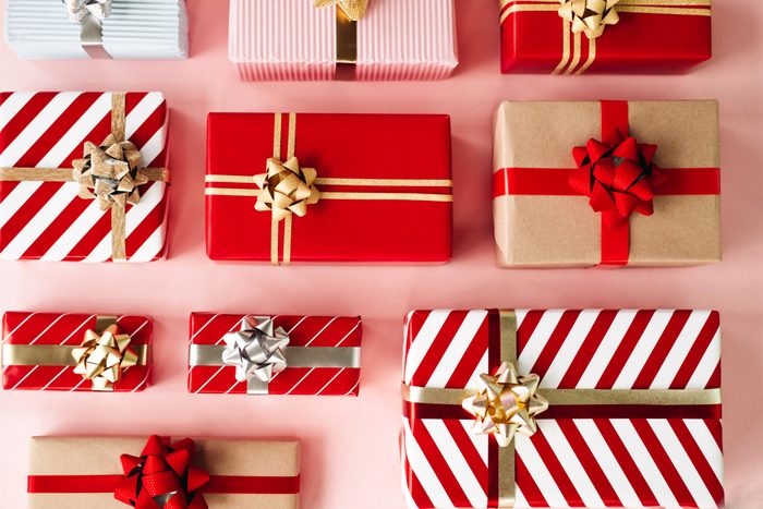 Many wrapped gift boxes on pastel background